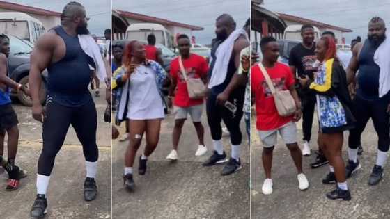 "Ladies love his body": Girl starstruck as she sees Kizz Daniel's macho bouncer, runs to take photos