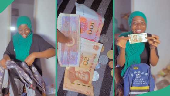Thrift vendor celebrates as she flaunts wads of foreign currencies she found in her bale of Bags