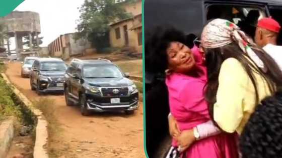 Nigerian lady shuts down her village after 11 years abroad, video shows her returning in convoy