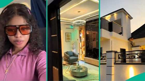 Nigerian lady over the moon as partner completes magnificent building project, video trends online