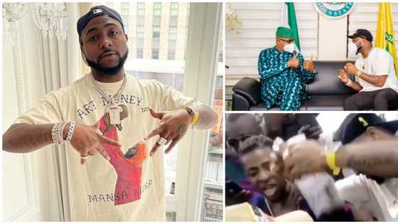 Singer Davido rains cash on fuji musician Pasuma at an event, links up with Ogun governor