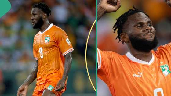 Frank Kessie cuts AFCON trophy cake with people after winning the tournament