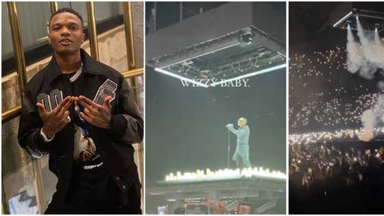 Wizkid suspended in the air, surrounded by candles as he makes spectacular entrance at O2 concert in London