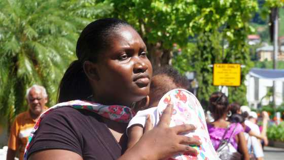 At my mother's funeral, a woman slipped a baby into my arms and said, 'She wanted you to have him'