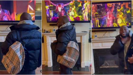 E choke: Davido screams excitedly as he watches himself perform in Coming 2 America movie