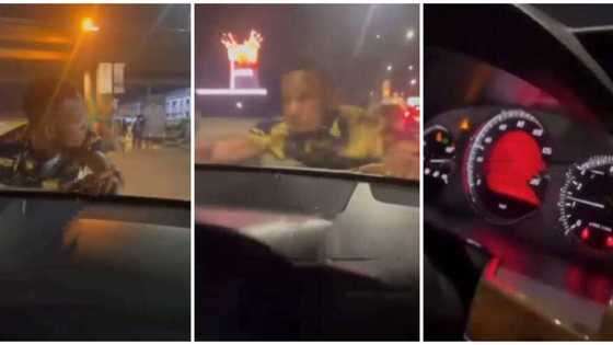Stubborn Nigerian man hangs on to bonnet of moving car because lady refused to give him cash, video goes viral