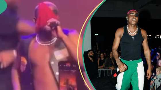 Videos trend as singer Ruger wears female fan’s pant on his head while performing at show: “It is finished”