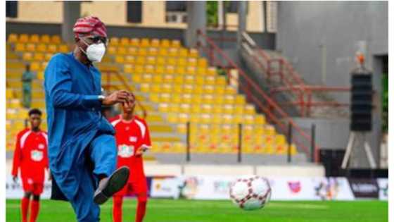 Powerful kick: Photo as APC governor takes breathtaking shot in football competition
