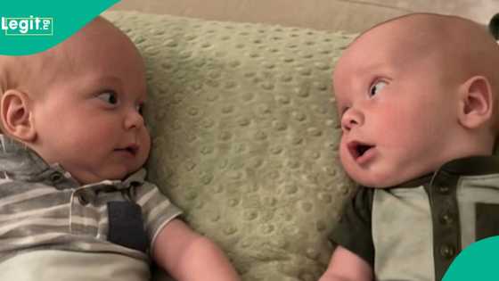 Twin babies share first smiles and eye contact, mother wishes their friendship will deepen