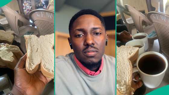 Man displays big bread and Coca-Cola he was given as holy communion at his village church