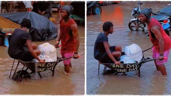 "One day I will make it": Man hustles in flooded area, carries woman in wheelbarrow in viral video
