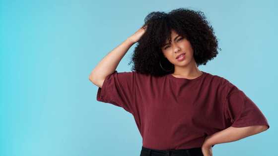 Mixed reactions as woman puts bosoms on display in tight kente corset outfit: "Doesn't look good"