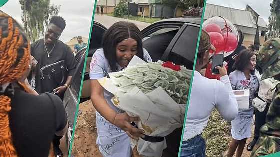 Man storms girlfriend's school with soldiers on her sign-out day, spoils her with cash and gifts