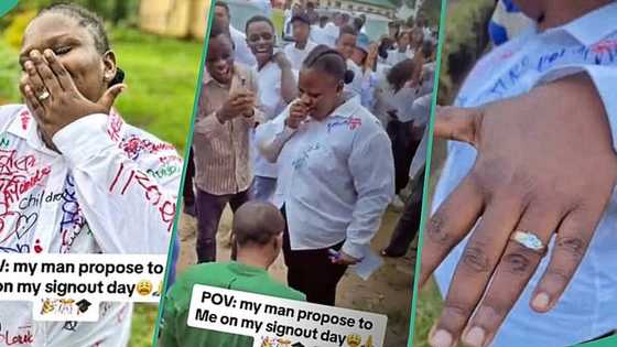 Female graduate rejoices as boyfriend proposes to her after writing her last paper in school