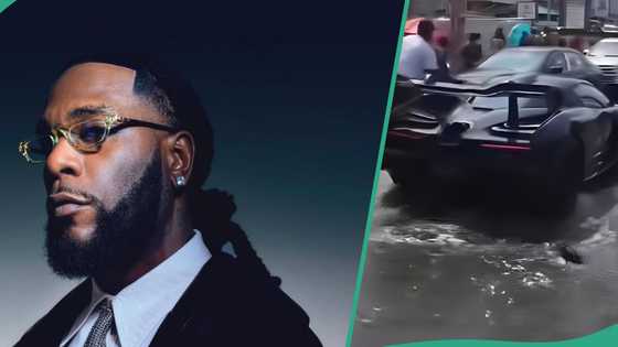 Clip of Burna driving N3.2bn McLaren in flood trends, sparks online talks: "Fix road for your toy"