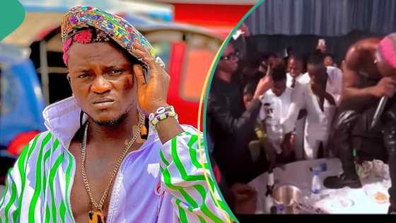 Drama as Portable stops performing to hustle for dollars sprayed on him at Abuja show: "Secure the bag"