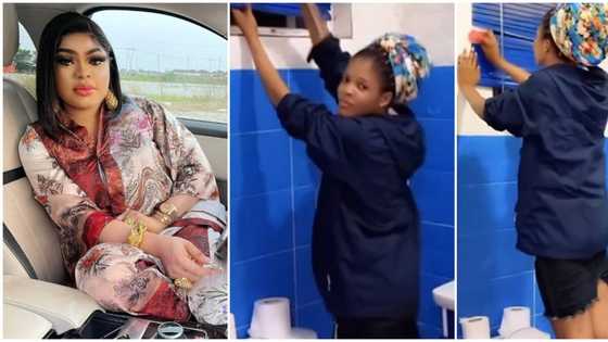 "This is so sad": Reactions as Bobrisky films maid washing his dirty toilet, orders her to climb water closet
