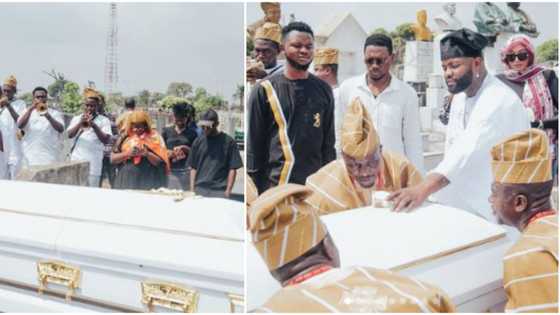 Emotional photos as singer Skales buries late mum, spotted giving her last look, pouring sand on casket