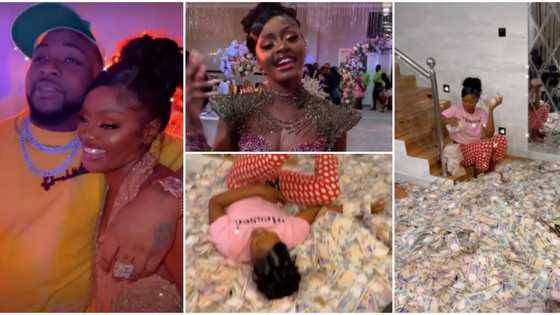 Davido, others storm Ama Reginald’s birthday party, celebrant swims in pool of cash after guests made it rain