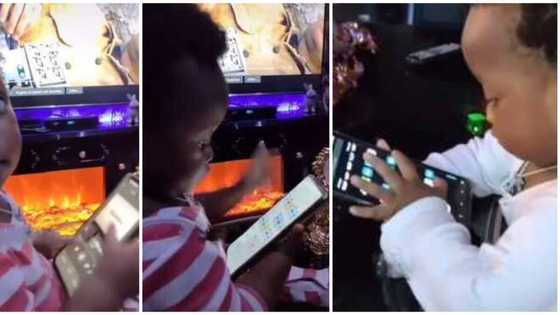 Reactions as little kid looks for Wizkid's song Essence on adult's phone herself, plays it in viral video