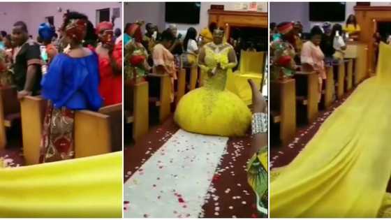 She doesn't have friends: Reactions as bride enters wedding venue rocking weird long yellow dress in video