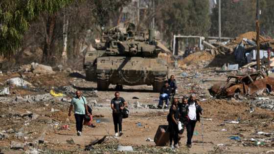 OECD trims global growth forecast, warns of conflict risk