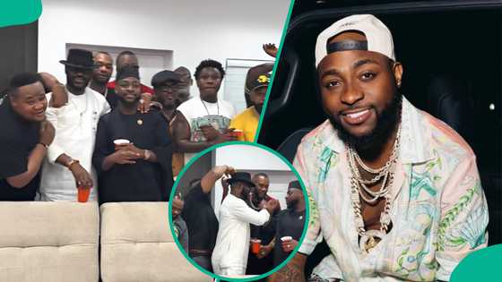 Davido’s presence at NBM gathering trends, fans react to singer with Black Axe members: “I see men”