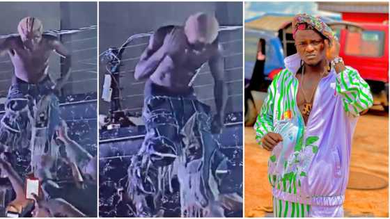 Portable displays unusualness during stage performance as he removes trousers and hits bottle on head