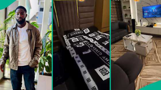 Young man shows off his fine rented flat with cool interior design, flat screen TV, big wardrobe