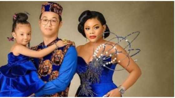 Oyibo man and Nigerian wife rock stylish Isiagu ensembles in cute family photo