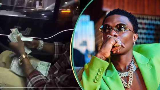 “Hope say no be ritual”: Wizkid sparks frenzy with video of him spraying money on Lagos streets