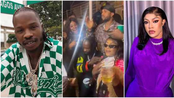 Naira Marley with the naira: Singer sprays bundles on Angela Okorie in exciting video from birthday party