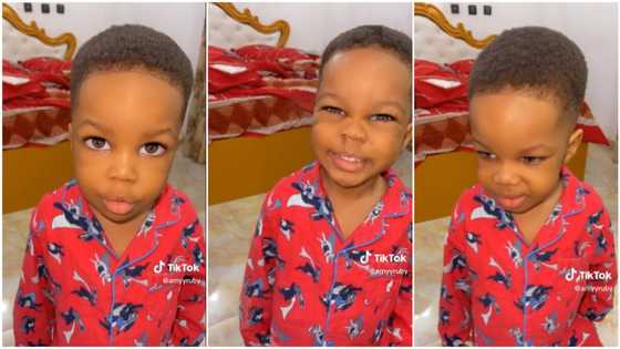 Mum asks 2-year-old child in beautiful pyjamas her name, he gives funny answer, smiles in cute video