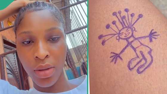 "I finally got it": Nigerian lady uses blue pen to draw tattoo on her arm, shares funny video