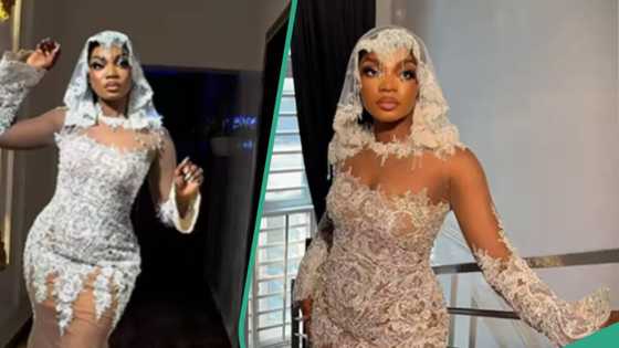 Bride slays in stylish wedding dress, gets accolades, video trends: "E be like u dey beef corset"