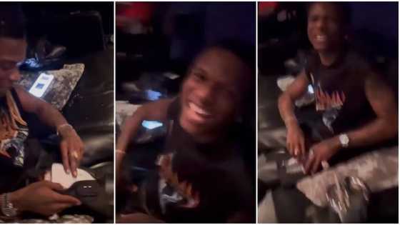 Wizkid spotted being playful in rare video, sprays his friend ‘loud’ instead of money for hailing him