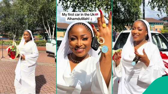 Nigerian lady buys first car in UK, wears matching white gown on her first ride