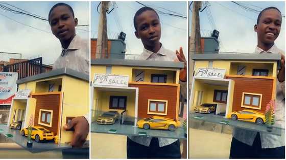 Creativity in action: Nigerian boy designs cute replica of one storey mansion, displays it proudly in video