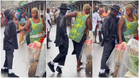 Man dances like Michael Jackson beside lady in market, she pushes him away, people watch