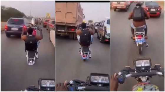 Video captures man using okada like power bike, he rides it on busy road with 1 tyre, people react