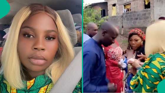 Nigerian lady storms her ex-boyfriend's wedding unannounced, sprays him and wife money in video