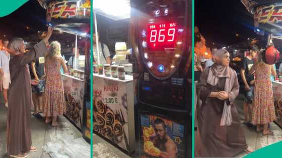 Lady in hijab delivers powerful punch at public punching machine, scores an impressive 869
