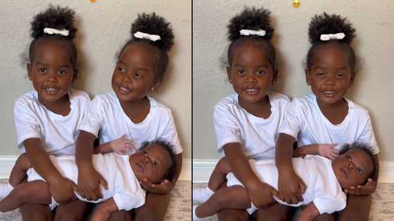 "I'm blessed to be their mother": Excited mum posts video of her twin babies holding her new child