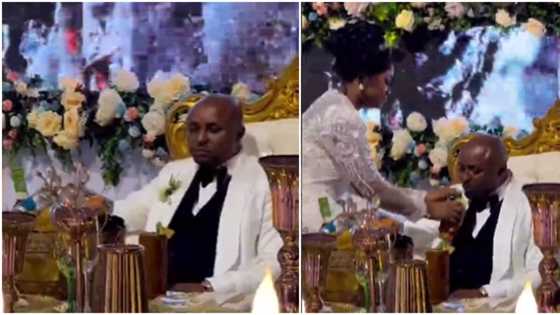 "Dey chew cake like pounded yam": Video shows Isreal DMW with 'strong' face as wife feeds him at their wedding