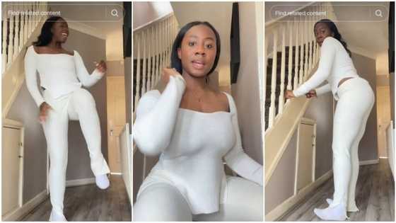 Nigerian lady in white socks & top lifts legs, shakes waist sweetly to song, gets men's attention