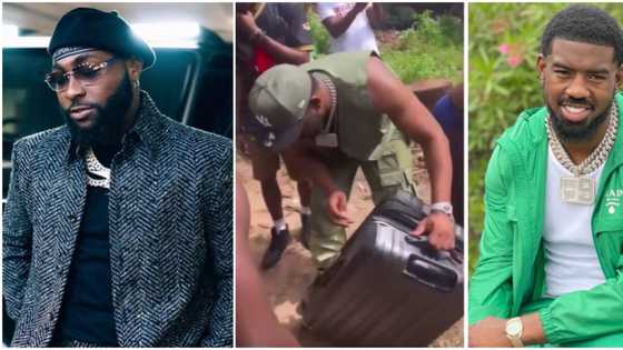 After performing at Davido’s concert, British rapper Tion Wayne distributes new clothes to a Lagos community