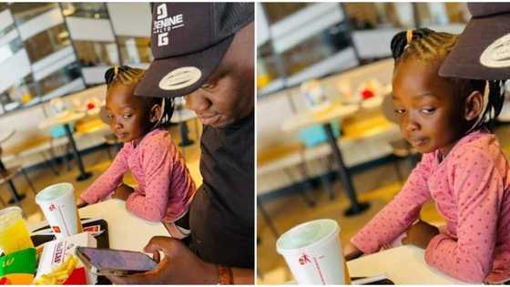 "Her mom sent her": Reactions over viral photo of little girl peeping into her dad's smartphone like a spy