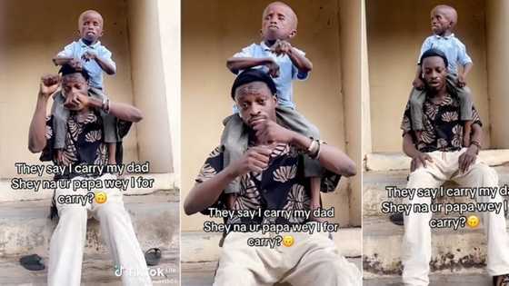 "Na your papa I for carry?" Man places smallish dad on his shoulder to dance, fires people dragging him