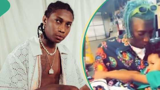Bella Shmurda carries Wizkid's Zion like a baby, introduces himself: "I'm your uncle"