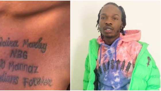 Naira Marley rendered speechless again as die-hard female fan tattoos his name on her chest